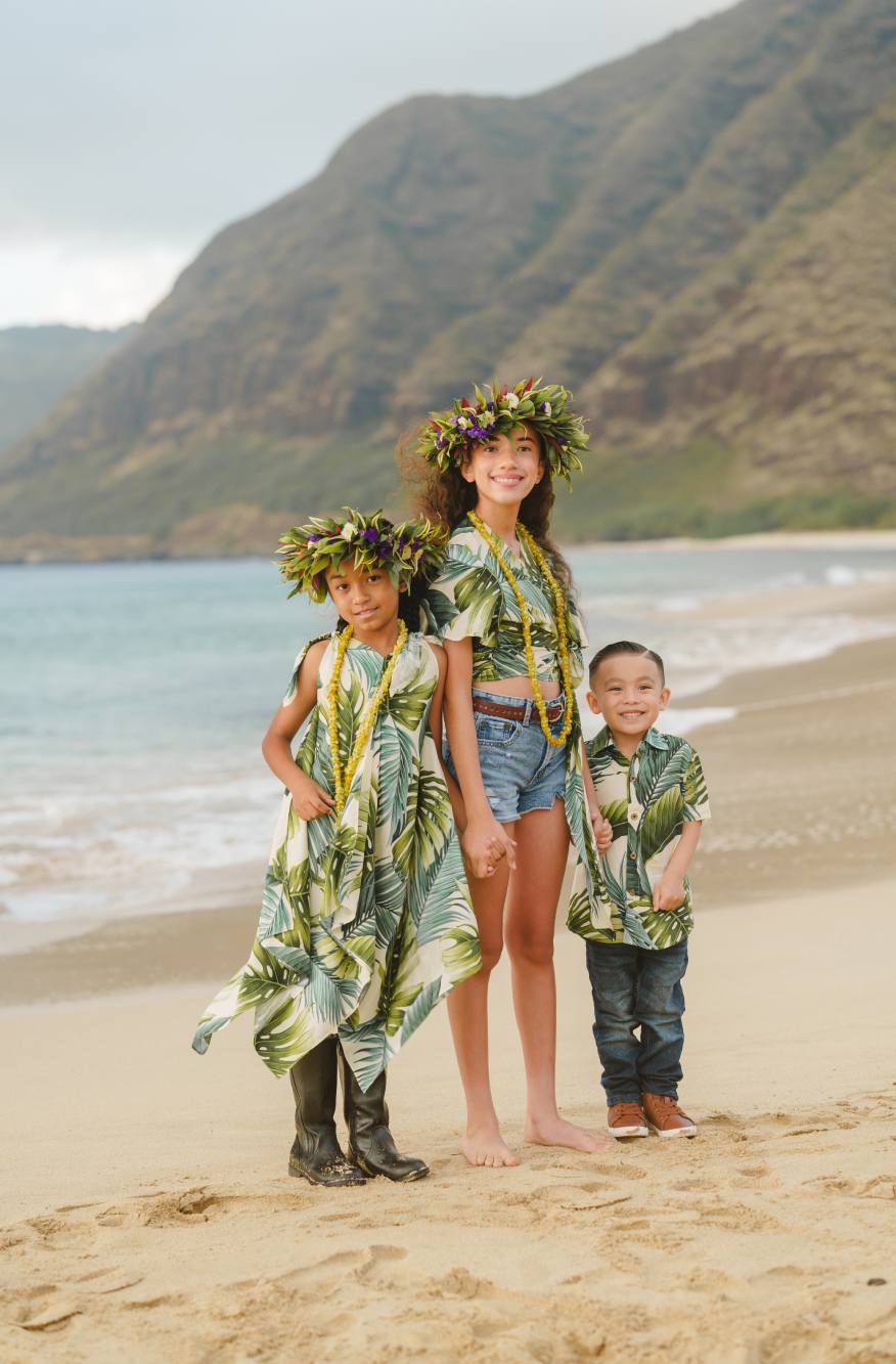 Kids wearing Hawaiian-inspired printed clothing